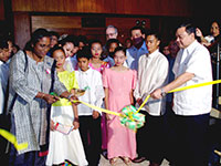 The ribbon cutting with the children writers, Mayor Jerry Trenas and Latha Caleb.