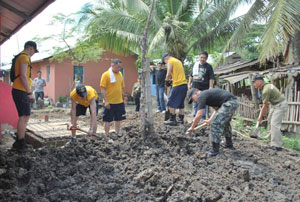 US Navy personnel with Councilor Homer Bais (3rd from right)