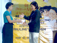 Ma. Theresa Enriquez Gaspar receives her certificate of participation.