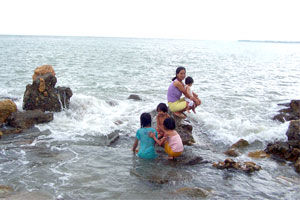 Yesterday's stormy weather did not prevent this family from bathing at Fort San Pedro in celebration of the feast of St. John the Baptist.