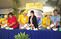 Jasmin Noble and SM's Kristine Rojo and Leo Sorita demonstrate how to wash hands properly.