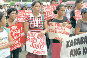 A young girl looks at “fellow” rallyists at the Iloilo Provincial Capitol grounds during Pres. Arroyo’s State of the Nation Address.