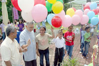 Archbishop Lagdameo, SOS Iloilo Director Rene Masungsong and the first seven children of SOS Village Iloilo.