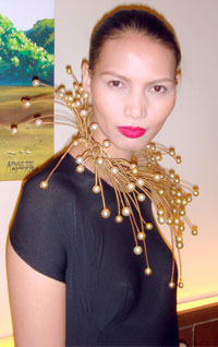 Radiant in a Jewelmer neck piece.