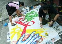 Anya and Christian finishing the mural painting