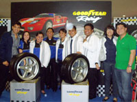 Emman Aguillon, Deanna Tingson, Macre Alejan, Manny Saavedra, Au Sanagustin, Jeff Borja, Dexter John Sevilla, Gen Aguillon and Ryan Chiong pose in Goodyear Racing Zone featuring Eagle F1 Asymmetric.