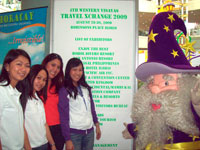 Enchanted Kingdom girls pose with Eldar their mascot.