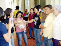 Sister Mary Fidelis Estrada (far right) with students.