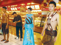 A pose at Tinapayan, The Atrium. Tiny Firmeza paints chocolate on the model.