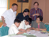 Even young kids (from left) Markey Daquilanea and Justin Francis Bionat sign up in support of the environmental compliance audit (ECA) drive. Also shown in photo are (from right) Engr. Aurora Alerta Lim of the Responsible Ilonggos for Sustainable Energy; Atty. Antonio Oposa, Jr., president of Law of Nature Foundation; Atty. Pauline Alfuente, Dean of University of Iloilo-College of Law; and Atty. Marven Daquilanea, president of Integrated Bar of the Philippines-Iloilo Chapter.