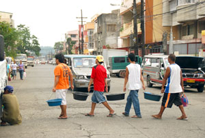 Fab four crossing the road? Nah, they are ambulant vendors of fish, crabs, and shrimp