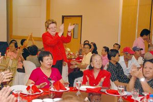 Dr. Pacita Gonzalez cheers as her son Congressman Raul Gonzalez Jr.