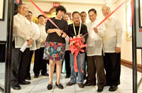 Iloilo City Tourism Officer Ben Jimena, assisted by Therese Jarantilla-Robles and President Carlos Garcia, opens the Annual Photo Contest-Exhibit. Looking on are members Dr. Malbar Ferrer, Alden Lim, Jessie Garcia, John Guevarra, Neil Valera and Romy Reyes.