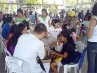 Volunteer doctors check some patients.