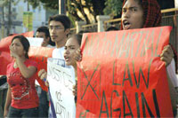 Members of the militant League of Filipino Students in Iloilo City hold a picket in protest of the declaration of Martial Law in Maguindanao.