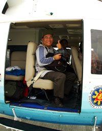 Dr. Ferrer inside a helicopte.