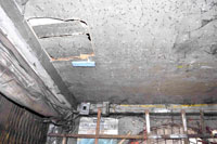 The hole on the ceiling made by the suspects to gain entry to the pawnshop.