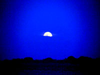Blue Moon rising as seen from the Inayan Beach Resort.