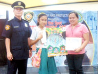 Dara Eloisah Yucarisa with coach Louelyn Reyes and a BOF officer.