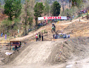 2009 RP Motocross Rider of the Year Kenneth San Andres shows off his best form in the finish line of the 1st Evelio Javier Invitational Supercross Championships in Valderrama