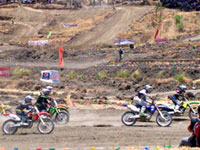 Participants in the 1st Evelio Javier Invitational Supercross Championships in Valderrama, Antique showcase their innate riding skills at the town's motocross racing complex with international standard.