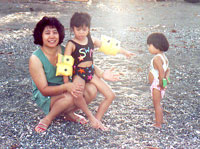 1994. Maria with JM on her lap and her soon to be adopted daughter.