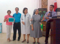 An awarding of the certificates to one of the representatives during the program