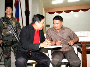 Winning mayoralty bet Vice Mayor Jed Patrick Mabilog talks to City Election Officer Atty. Roberto Salazar inside the Department of Education Social Hall