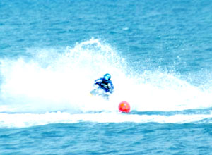 A jet skier rides the waves off the Guimaras Strait as he enjoys the remaining days of summer.