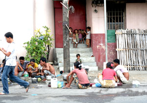 A typical day for a group of Aetas living outside an old building in Muelle Loney Street.