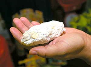 ALTERNATIVE TO CHARCOAL. A hand shows a paper baguette, which is a good alternative to charcoal.