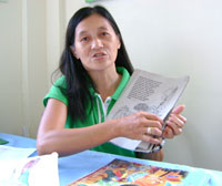 Day care worker Mayflor L. Geca explains her students love to color their coloring books and hear stories like Juan Tamad.