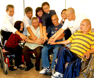 DIFFERENTLY ABLED. Leaders of persons with disabilities groups and their supporters, marking the 32nd National Disability Prevention and Rehabilitation Week, put their hands together in a gesture of unity