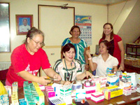 Josette Jardiolin of Milagrosa-J Shipping (left) who is also a Lion with other volunteers at the pharmacy.