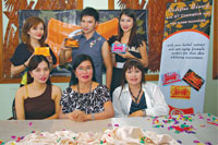 Leonora Salvane, founder and owner of GT Cosmetics (seated, middle) with Jellie Marie Salvane, pharmacist; Jeng Doblas, Vismin sales supervisor and the models.