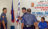 TURN-OVER. Chief Supt. Samuel Pagdilao, police regional director, presides the turn-over of command between outgoing Iloilo Provincial Police Office director, Senior Supt. Renato Gumban, and his successor Senior Supt. Gil Levin at the IPPO headquarters in Sta. Barbara, Iloilo yesterday, in the presence of Gov. Arthur Defensor Sr.