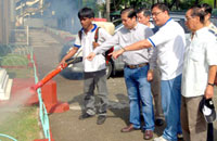 Mayor Jed Patrick Mabilog and Chinese Filipino Business Club Director Richard Alviar observe a fogging operation at the Iloilo City Central Elementary School, with businessmen Charlie Ho, Emilio Cua Locsin, Francis Sio and Oscar Chua.
