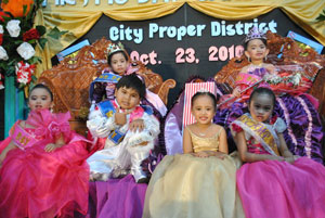 Lance Angelo Lucido and Janna Ysabelle Lindero (with their court) are crowned Mr. and Miss Day Care 2010 of Iloilo City