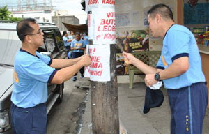 Chief Supt. Cipriano Querol Jr., police regional director, (left) leads the post-election clean-up