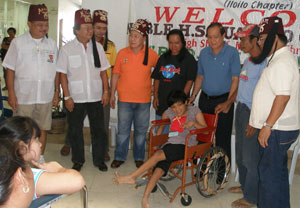 Iloilo Gov. Arthur Defensor, with one of the 36 beneficiaries of the wheelchairs,