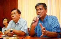 Atty. Romeo Gerochi, a member of the MIWD interim board, speaks to reporters, with general manager Le Jayme Jalbuena and fellow director Jessica Salas (left).