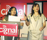 Aida  Baltazar, Cignal's managing director and Annie Naval, sales and marketing for MediaQuest Holdings, Inc.