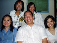 Standing: Heidi Foulc, directress of UI Basic Education Dept. and a BED teacher. Seated: Daisy Montinola, PEN chief finance manager; Dr. Chito Salazar, UI-PEN president; Esther Galvez, PEN Special Projects manager.