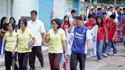 Department Sports Coordinators lead their players during the foot parade.