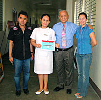 Dr Zapanta (3rd from left) with staff and an academic scholar.